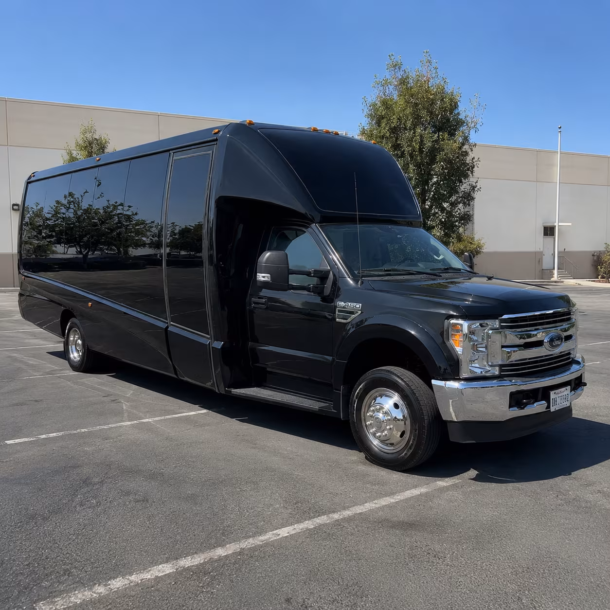 Group beside a Mercedes Sprinter limo in Louisville