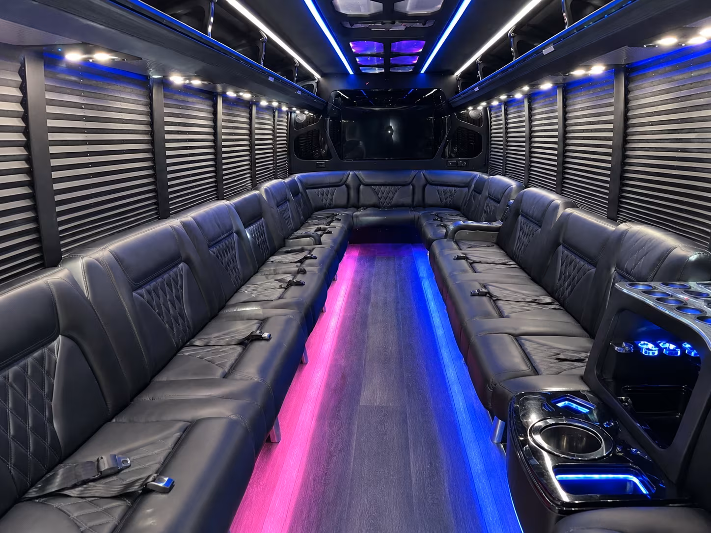 Wedding guests seated inside a party bus serving Louisville